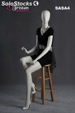 Abstract female mannequin sitting pearl white