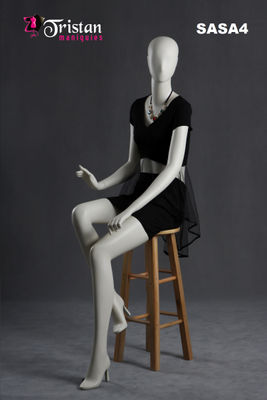 Abstract female mannequin sitting pearl white