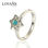 anillo plata/chapado con flor+un piedra azul - 1