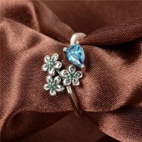 anillo plata/chapado,diseño de tres flores con un circón azul grande - Foto 5