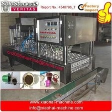 Coffee capsule filling and sealing machine