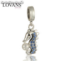 colgante plata para pulsera, diseño de un hipocampo con una perla+pieras azules