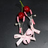 Lindas pinzas para pezones con forma de campana y cinta rosa