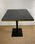 mesa hostelería tablero imitación marmol negro canto dorado pie hierro negro - Foto 3