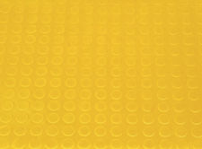 Pavimento relieve circular amarillo (botones, pirelli)