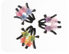 Pinzas para pezones decoradas con caramelos en forma de estrella