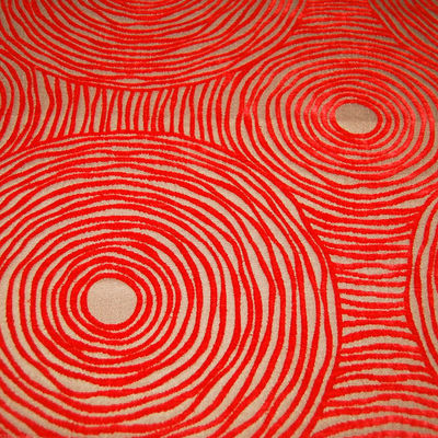 Tessuto disegno concentrico in velluto tonalità rosso